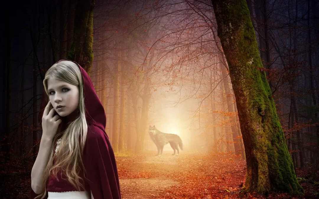 Jeune fille en cape rouge dans une forêt avec un loup.